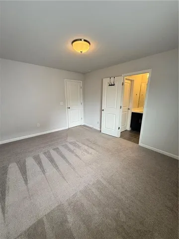 a bathroom with a sink a toilet a mirror and a tub