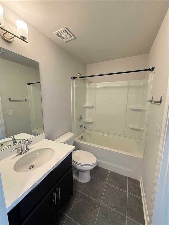 4610 Sandy Creek Drive Cumming, GA 30028 - Photo 38 of 49 a bathroom with a sink a toilet a mirror and a tub