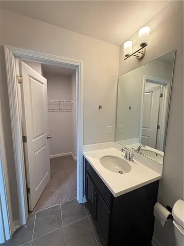 a room with a wooden floor and white walls