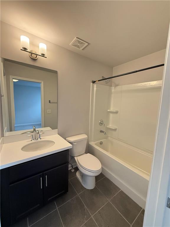4610 Sandy Creek Drive Cumming, GA 30028 - Photo 42 of 49 a bathroom with a double vanity sink toilet mirror and shower