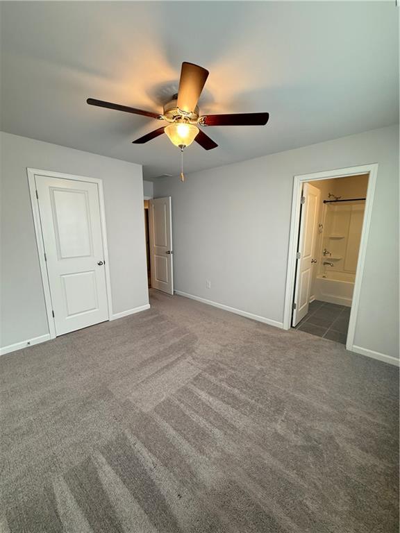 4610 Sandy Creek Drive Cumming, GA 30028 - Photo 44 of 49 a view of an empty room and a ceiling fan