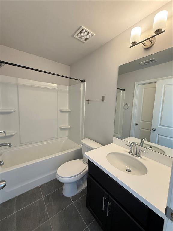 4610 Sandy Creek Drive Cumming, GA 30028 - Photo 45 of 49 a bathroom with a sink a toilet and a bathtub