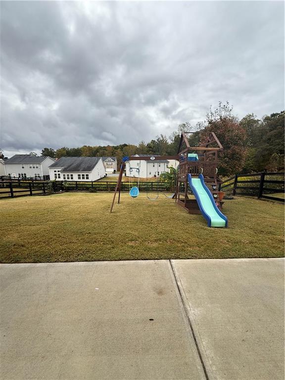 4610 Sandy Creek Drive Cumming, GA 30028 - Photo 47 of 49 a view of a garden and lake