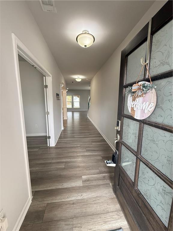4610 Sandy Creek Drive Cumming, GA 30028 - Photo 5 of 49 a view of entryway and hall with wooden floor