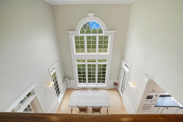 a view of an entryway with wooden floor