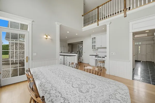 a bedroom with kitchen island a bed and a view of kitchen