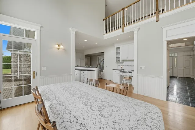 a bedroom with kitchen island a bed and a view of kitchen