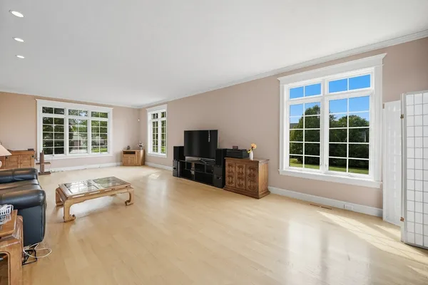 a view of a livingroom with furniture and a flat screen tv