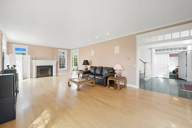 a living room with furniture window and a fireplace