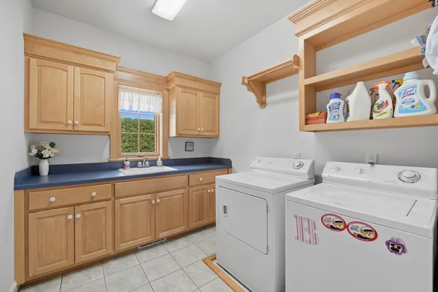 a utility room with closet dryer and washer