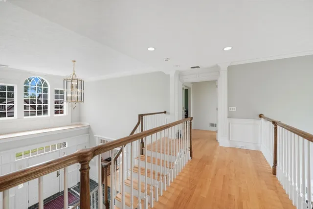 a view of an entryway with wooden floor