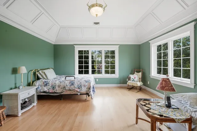 a large white tub sitting next to a large window