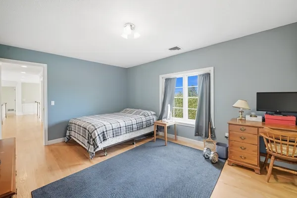 a bathroom with a sink toilet a mirror and shower