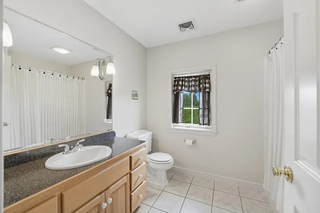 a view of a room with gym equipment and a window