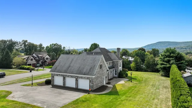 a aerial view of a house with a yard