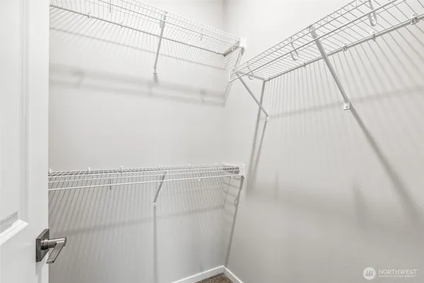 a bathroom with a sink toilet a mirror and shower