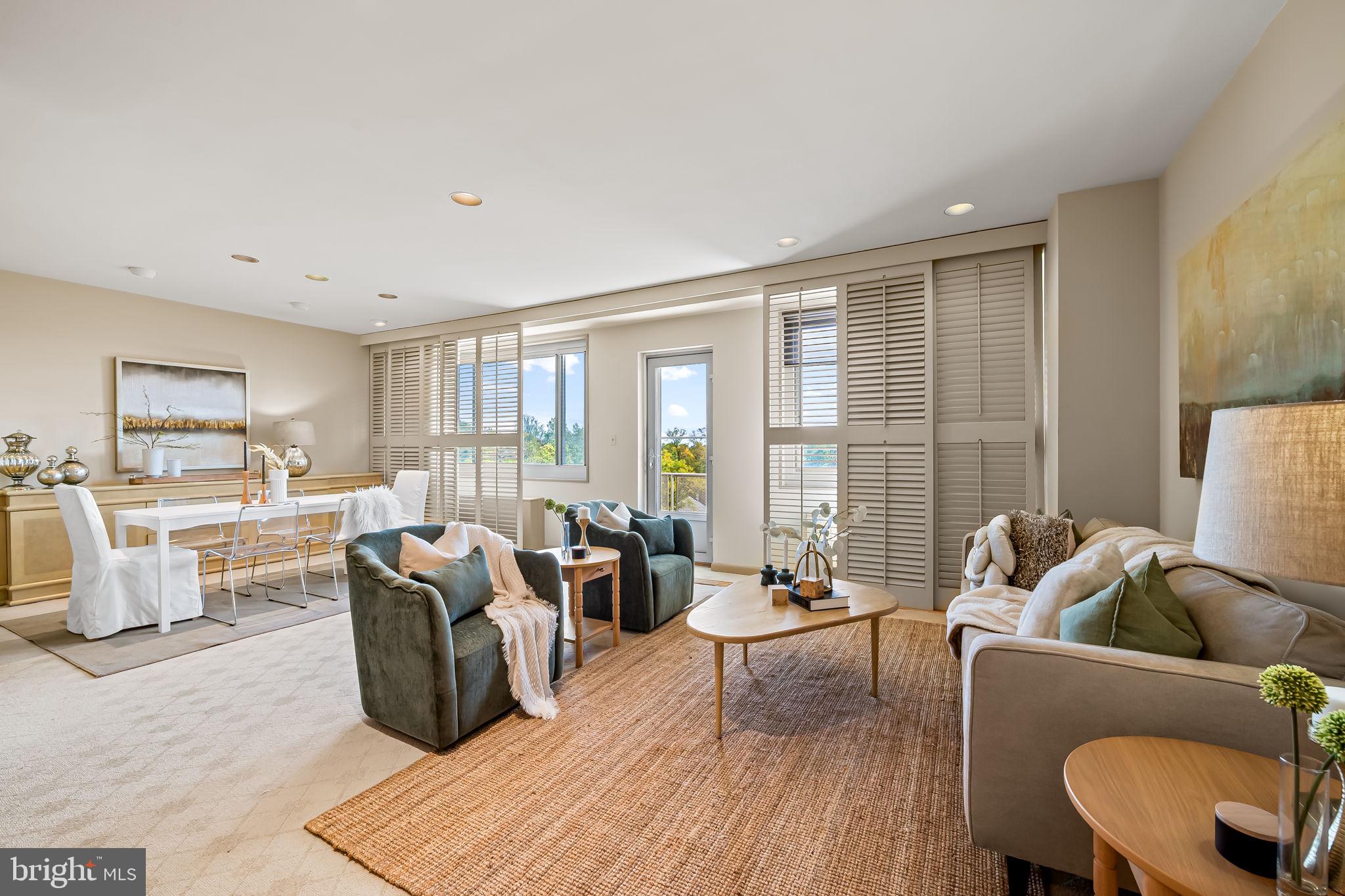 11 Slade Avenue, Unit 604 Baltimore, MD 21208 - Photo 11 of 36 a living room with furniture and a large window