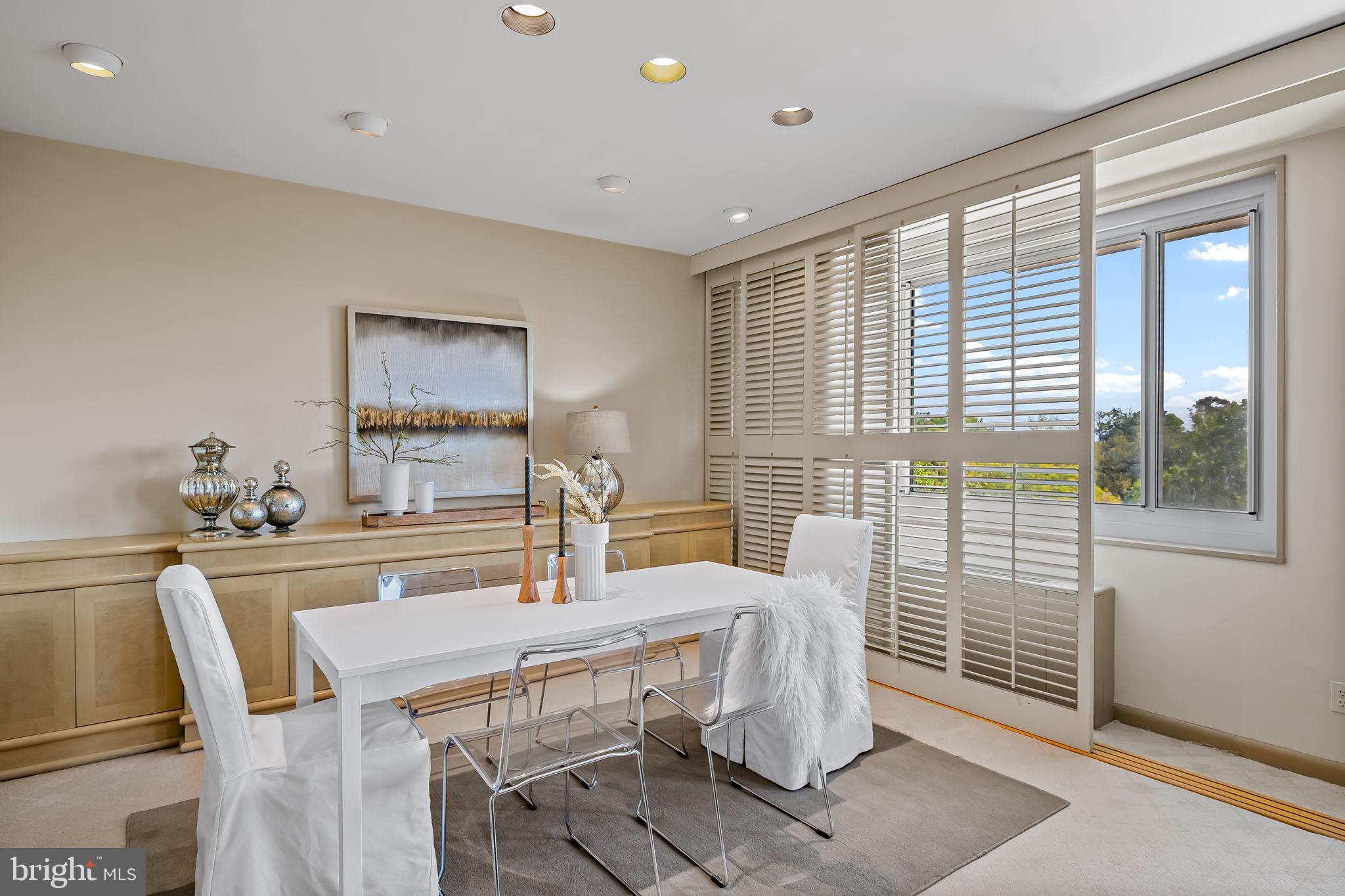 11 Slade Avenue, Unit 604 Baltimore, MD 21208 - Photo 12 of 36 a dining room with furniture and window