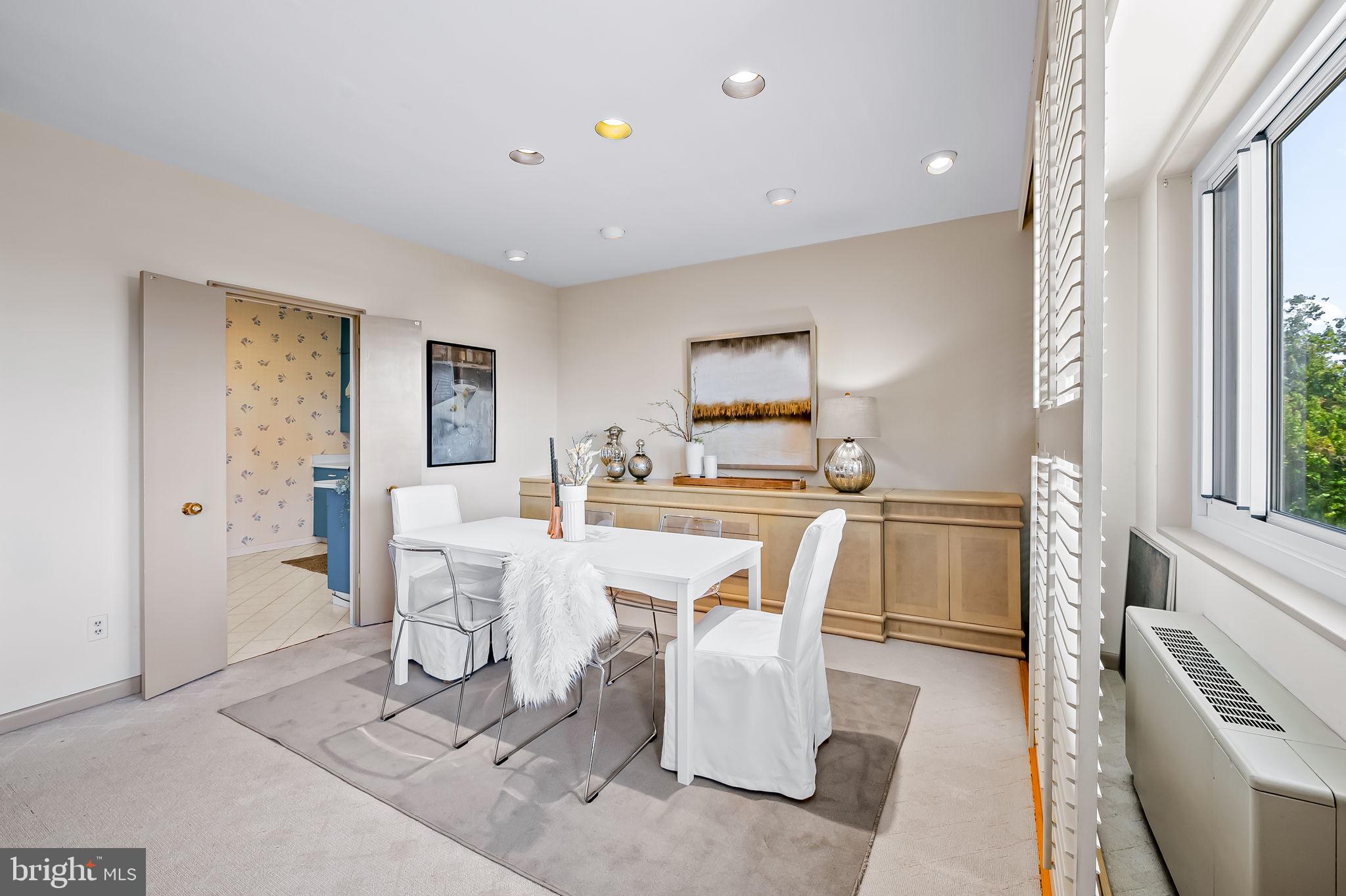 11 Slade Avenue, Unit 604 Baltimore, MD 21208 - Photo 15 of 36 a living room with dining room and wooden floor