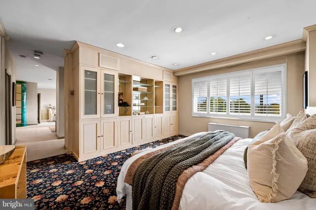 a bedroom with bed and window