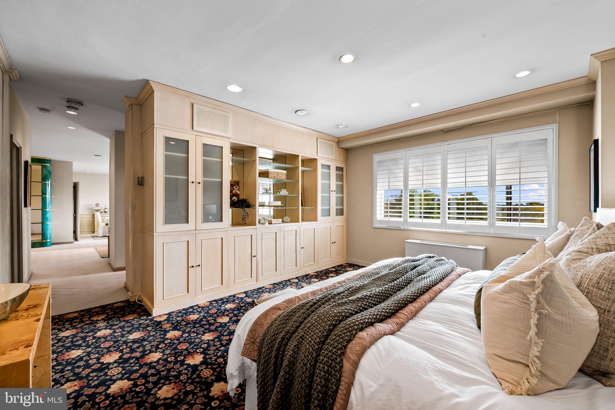 11 Slade Avenue, Unit 604 Baltimore, MD 21208 - Photo 26 of 36 a bed sitting in a spacious bedroom next to a window