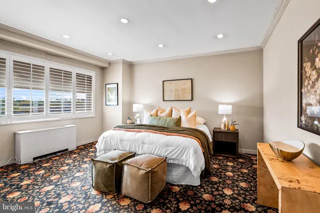 a bedroom with bed and window