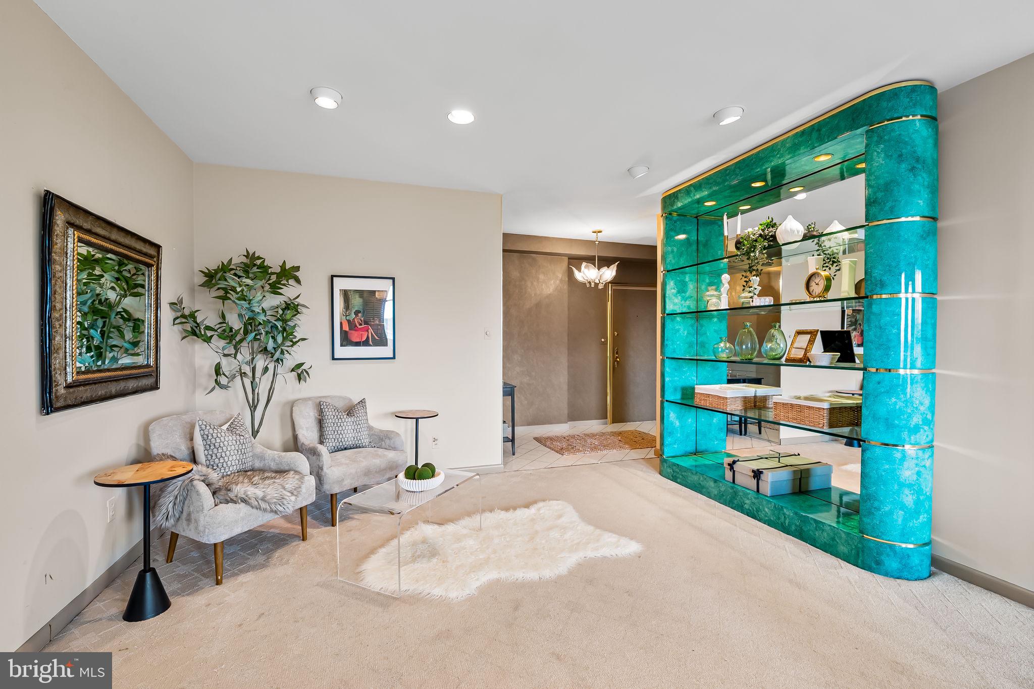 11 Slade Avenue, Unit 604 Baltimore, MD 21208 - Photo 8 of 36 a living room with furniture a window and a potted plant