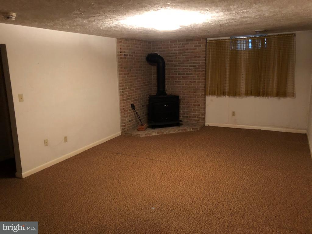419 Chancellor Road York, PA 17403 - Photo 14 of 32 Family room with fireplace