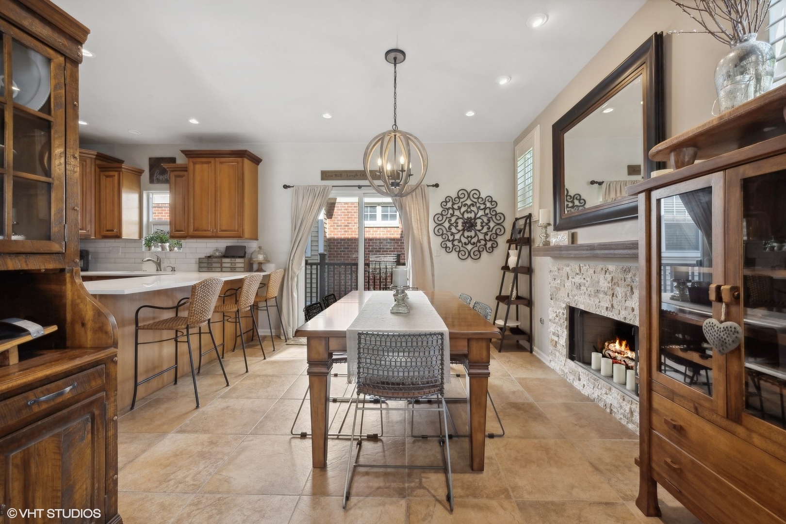3834 North Milwaukee Avenue, Unit 11 Chicago, IL 60641 - Photo 13 of 46 a dining room with furniture a fireplace and chandelier