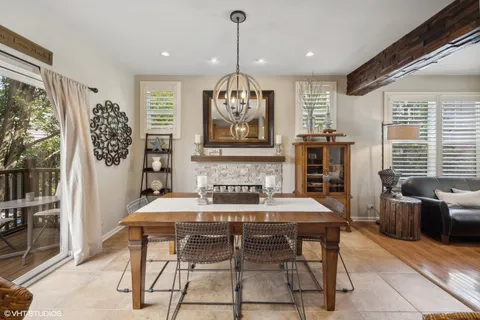 a view of a dining room with furniture window and outside view