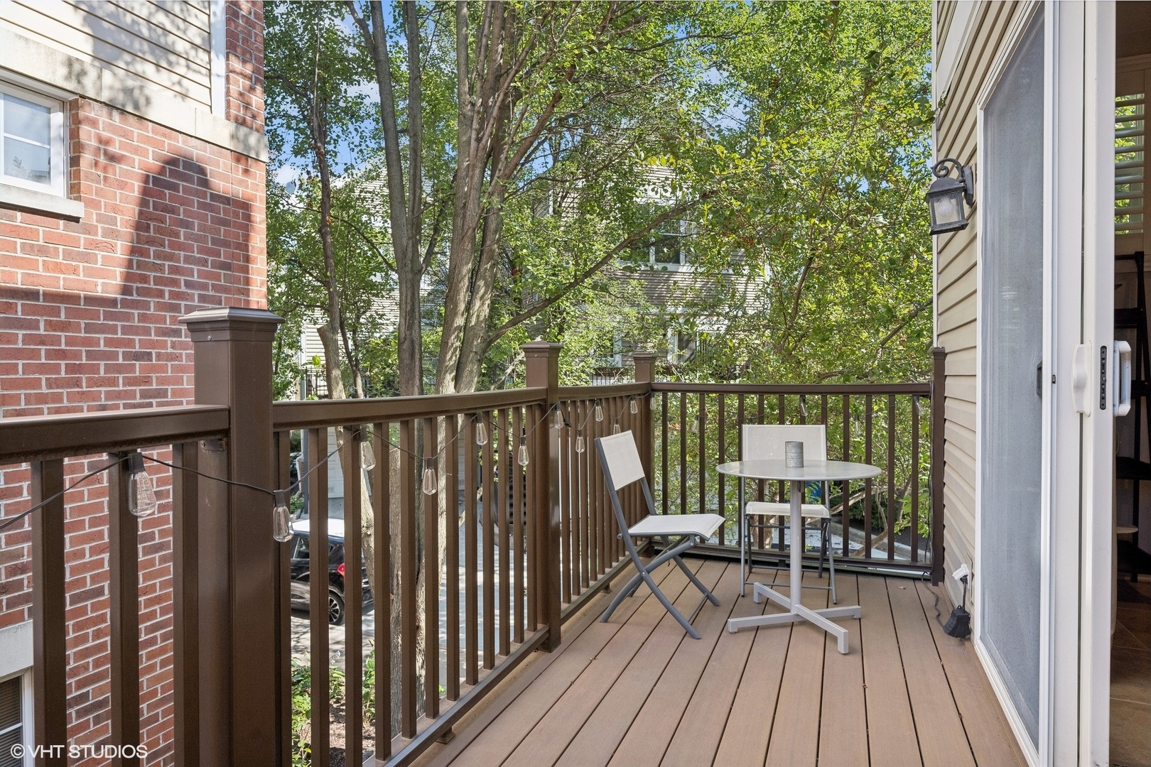 3834 North Milwaukee Avenue, Unit 11 Chicago, IL 60641 - Photo 20 of 46 a view of balcony with wooden floor and fence