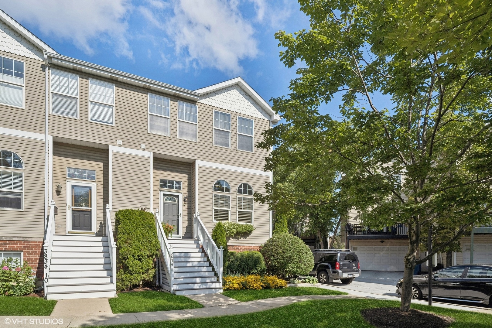 3834 North Milwaukee Avenue, Unit 11 Chicago, IL 60641 - Photo 2 of 46 a front view of a house with garden and porch
