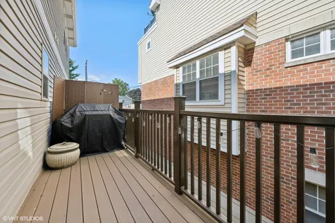 a view of a balcony with wooden floor