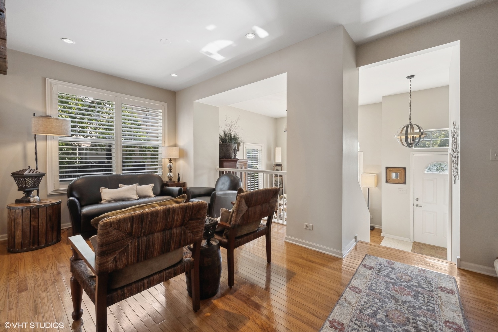 3834 North Milwaukee Avenue, Unit 11 Chicago, IL 60641 - Photo 27 of 46 a bedroom with furniture and a wooden floor