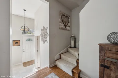 a bedroom with a bed window and wall painting