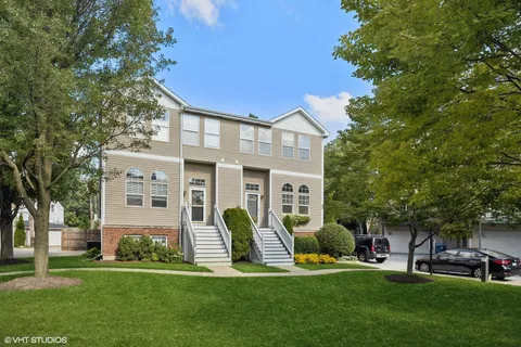a view of a house with a yard porch and sitting area
