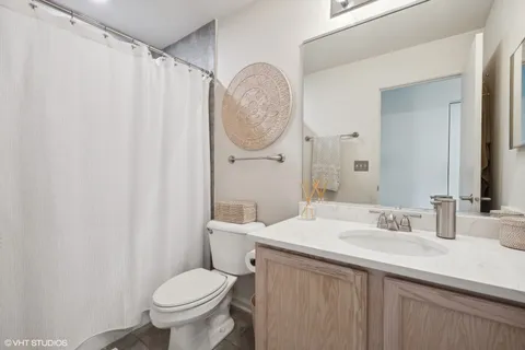 a spacious bedroom with a bed and a window