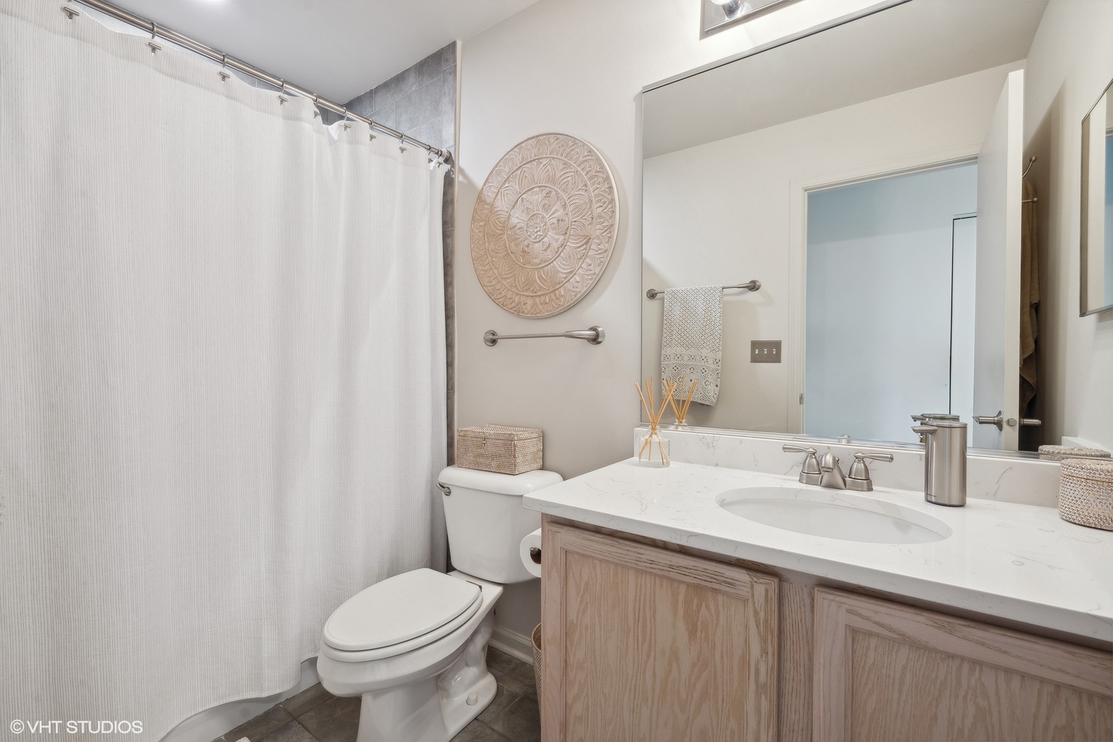 3834 North Milwaukee Avenue, Unit 11 Chicago, IL 60641 - Photo 32 of 46 a bathroom with a sink toilet and a mirror