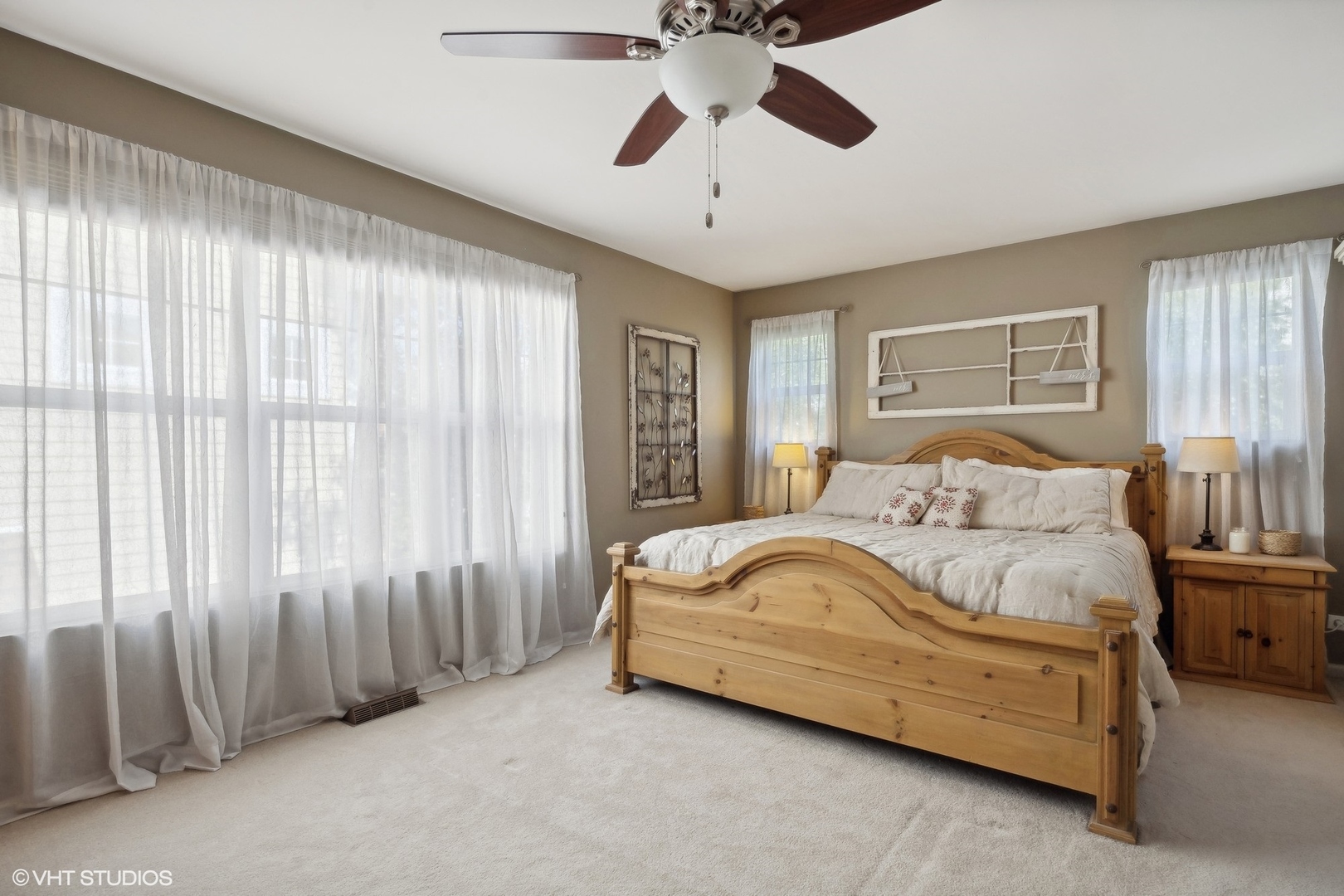 3834 North Milwaukee Avenue, Unit 11 Chicago, IL 60641 - Photo 33 of 46 a spacious bedroom with a bed and a chandelier