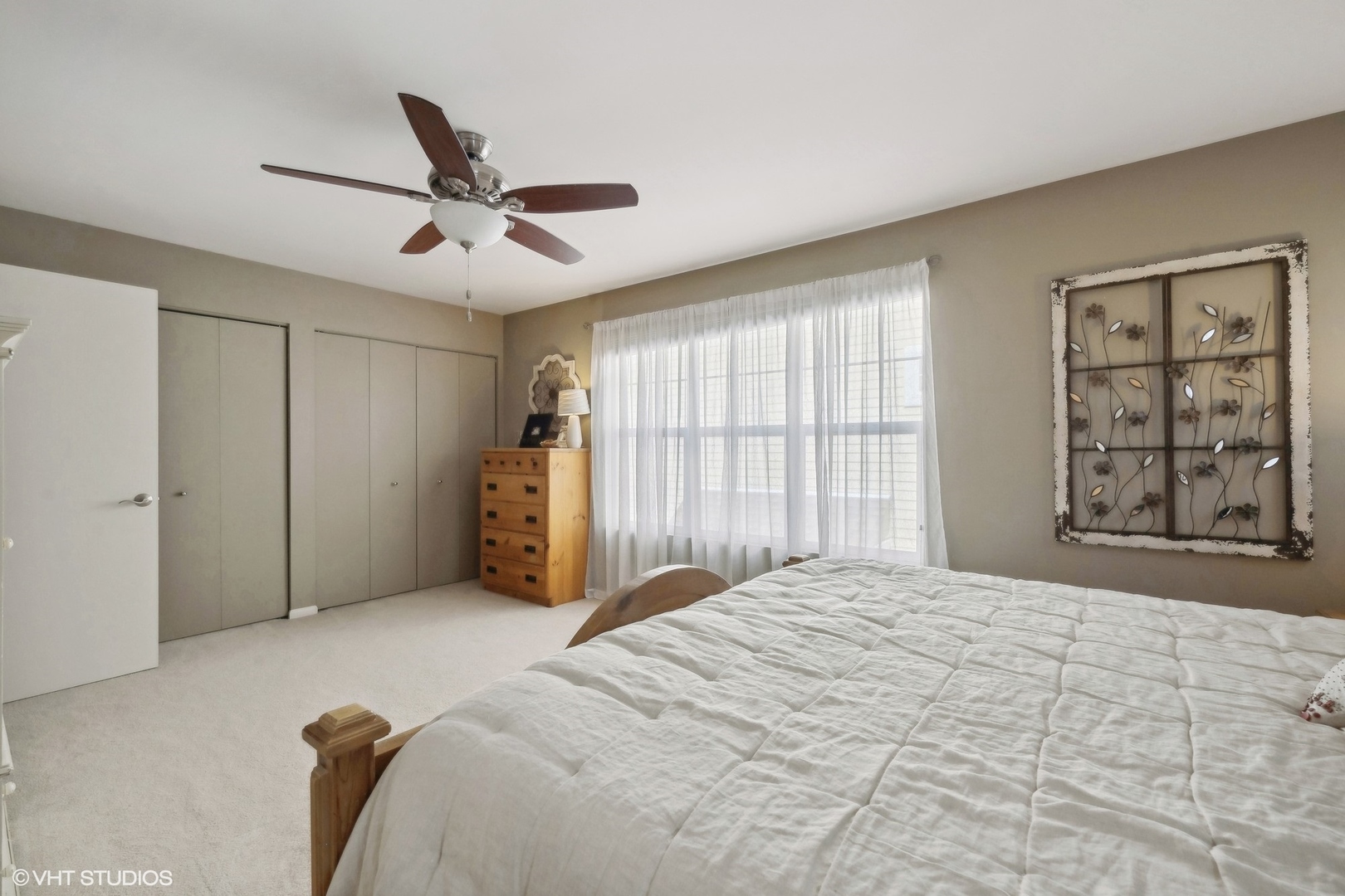 3834 North Milwaukee Avenue, Unit 11 Chicago, IL 60641 - Photo 36 of 46 a bedroom with a large bed and a large window