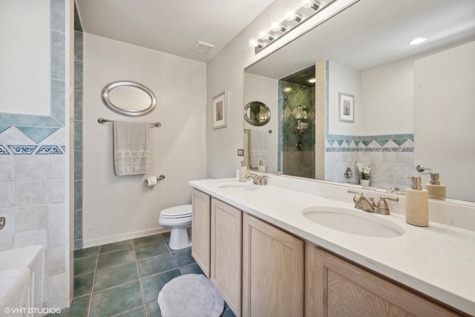 3834 North Milwaukee Avenue, Unit 11 Chicago, IL 60641 - Photo 37 of 46 a bathroom with a toilet sink and mirror