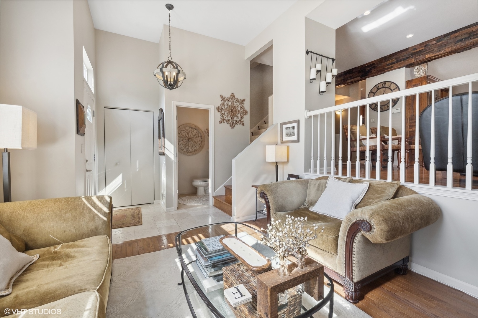 3834 North Milwaukee Avenue, Unit 11 Chicago, IL 60641 - Photo 6 of 46 a living room with furniture a dining table and a chandelier