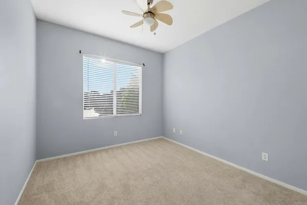 wooden floor in ceiling room with windows