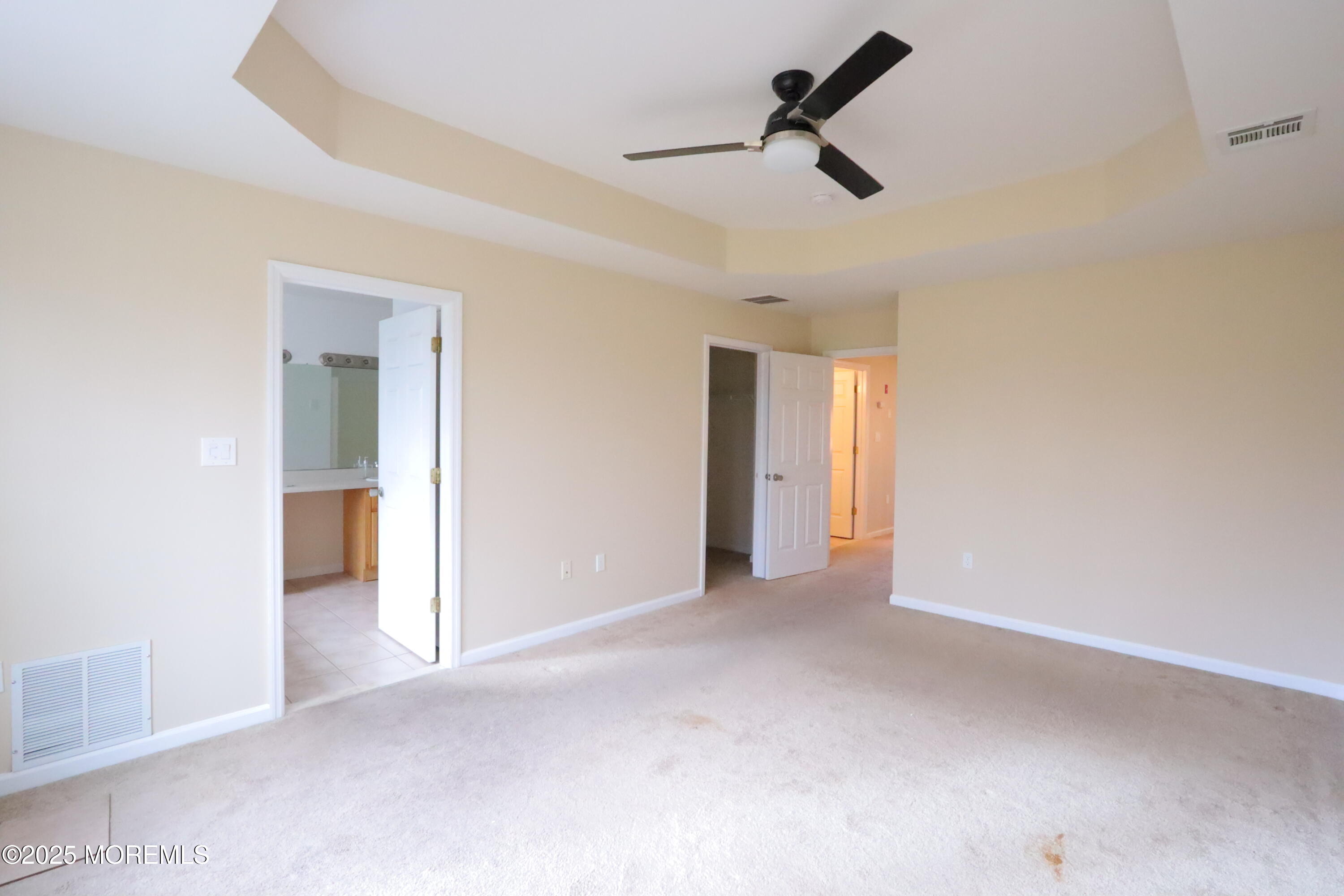 100 Pine Street, Unit 3 Lakehurst, NJ 08733 - Photo 11 of 20 a view of an empty room and chandelier fan