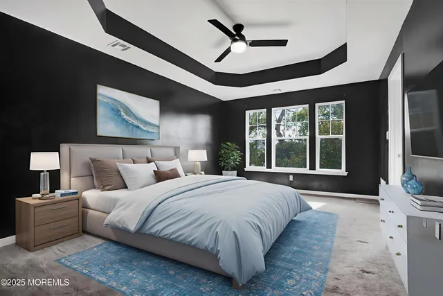 a spacious bedroom with a large bed and a large window