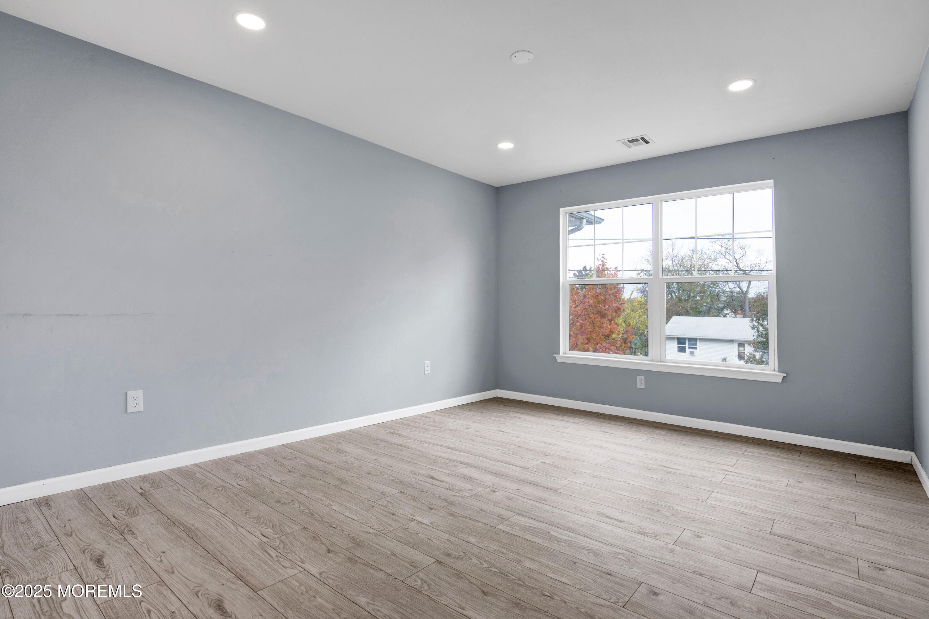 100 Pine Street, Unit 3 Lakehurst, NJ 08733 - Photo 13 of 20 wooden floor in an empty room with a window