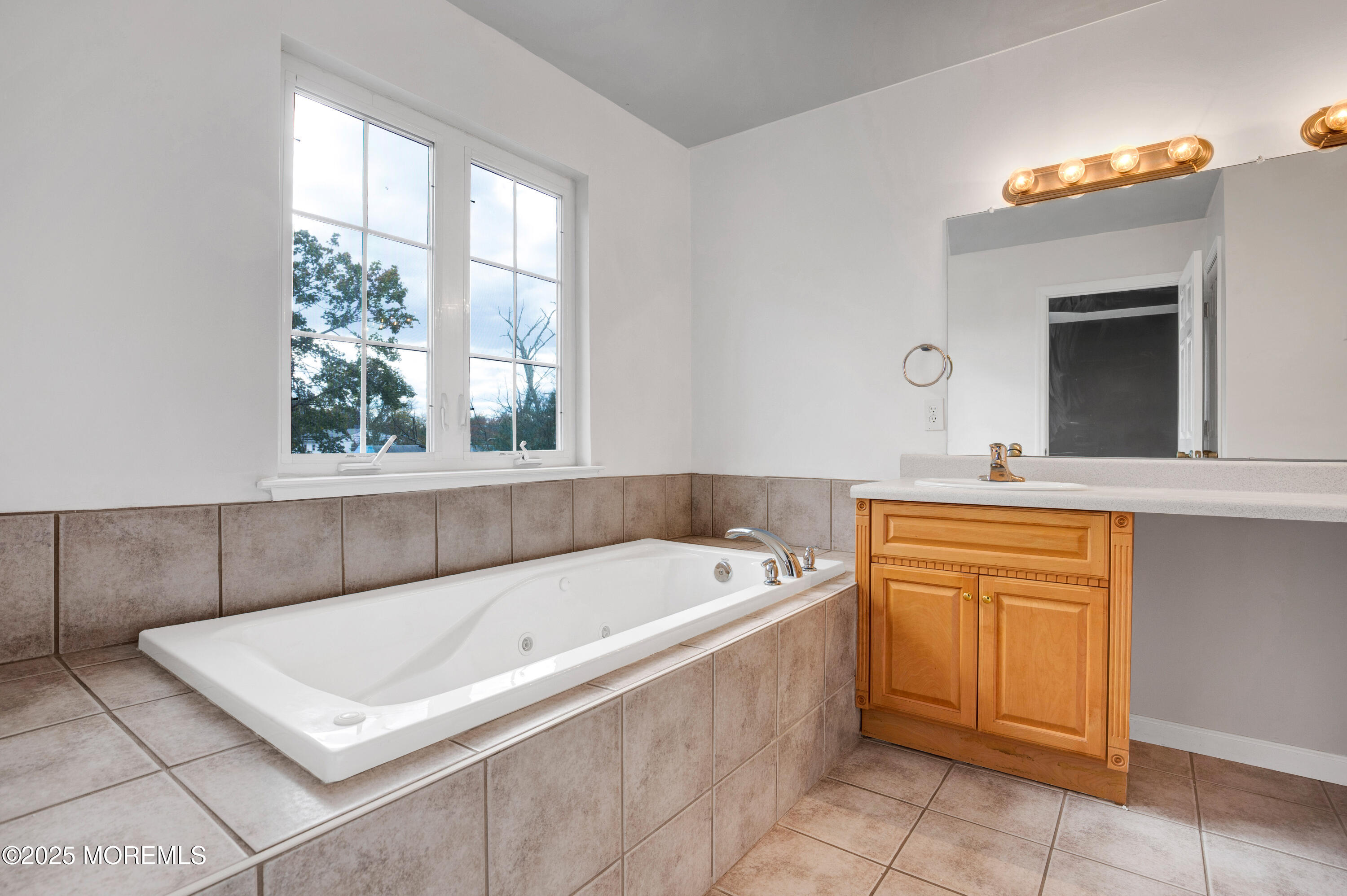 100 Pine Street, Unit 3 Lakehurst, NJ 08733 - Photo 14 of 20 a bath tub sitting in a bathroom next to a window