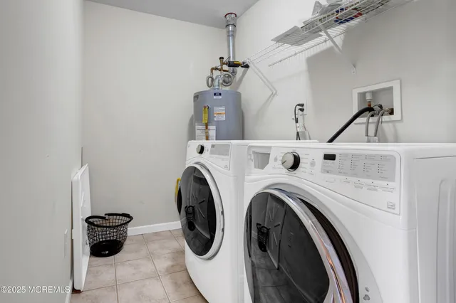 a view of a washer and dryer in a utility room