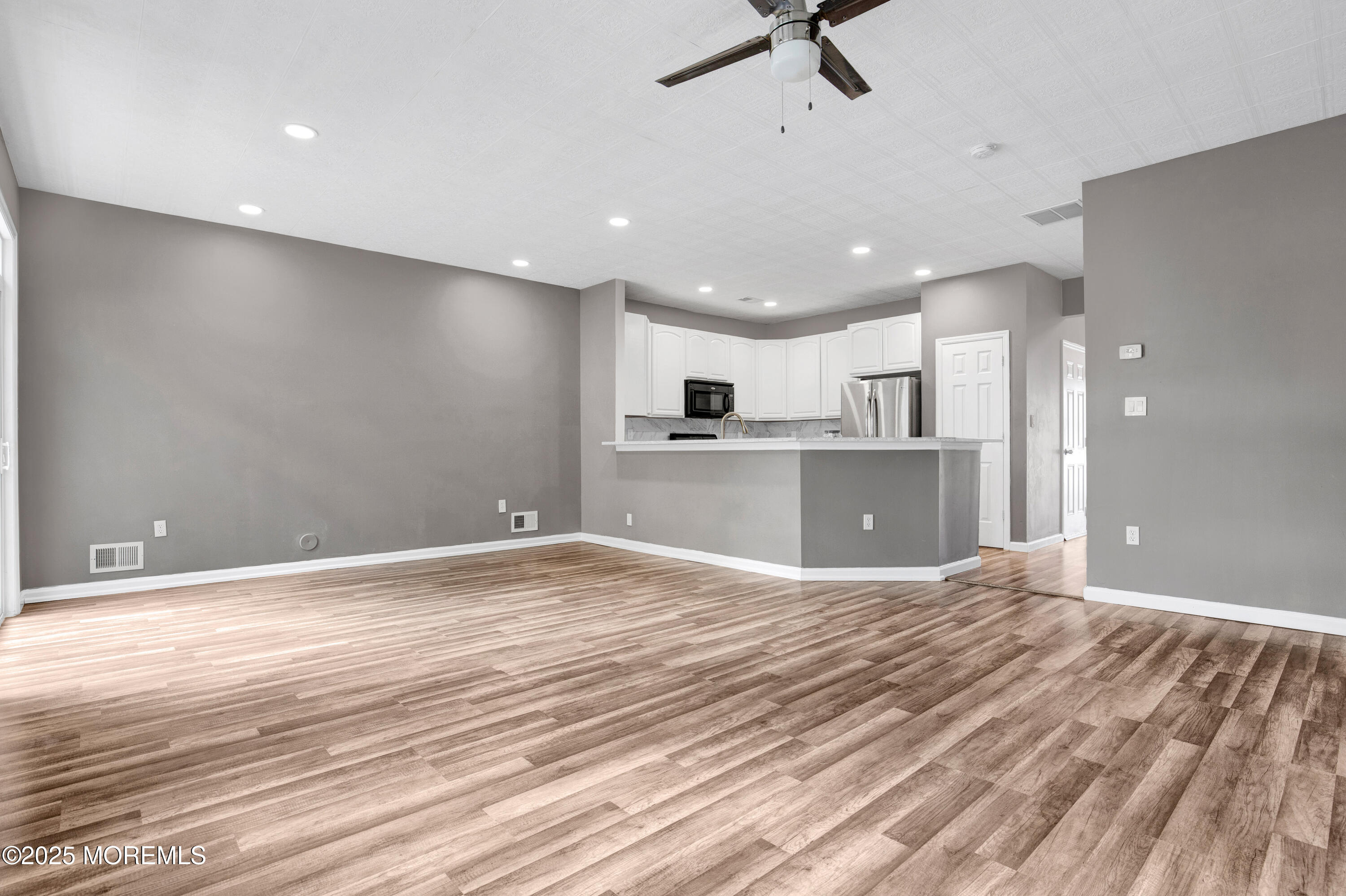 100 Pine Street, Unit 3 Lakehurst, NJ 08733 - Photo 6 of 20 a view of a kitchen with a sink and a refrigerator