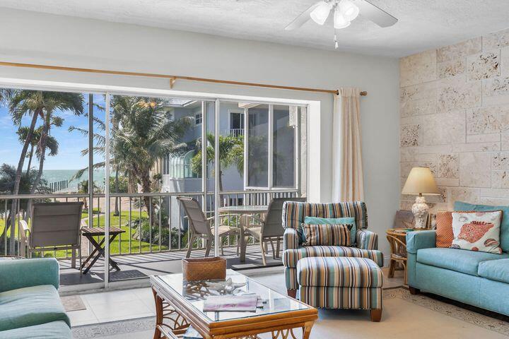140 Aregood Lane, Unit C2 Islamorada, FL 33036 - Photo 3 of 49 a living room with furniture and a large window